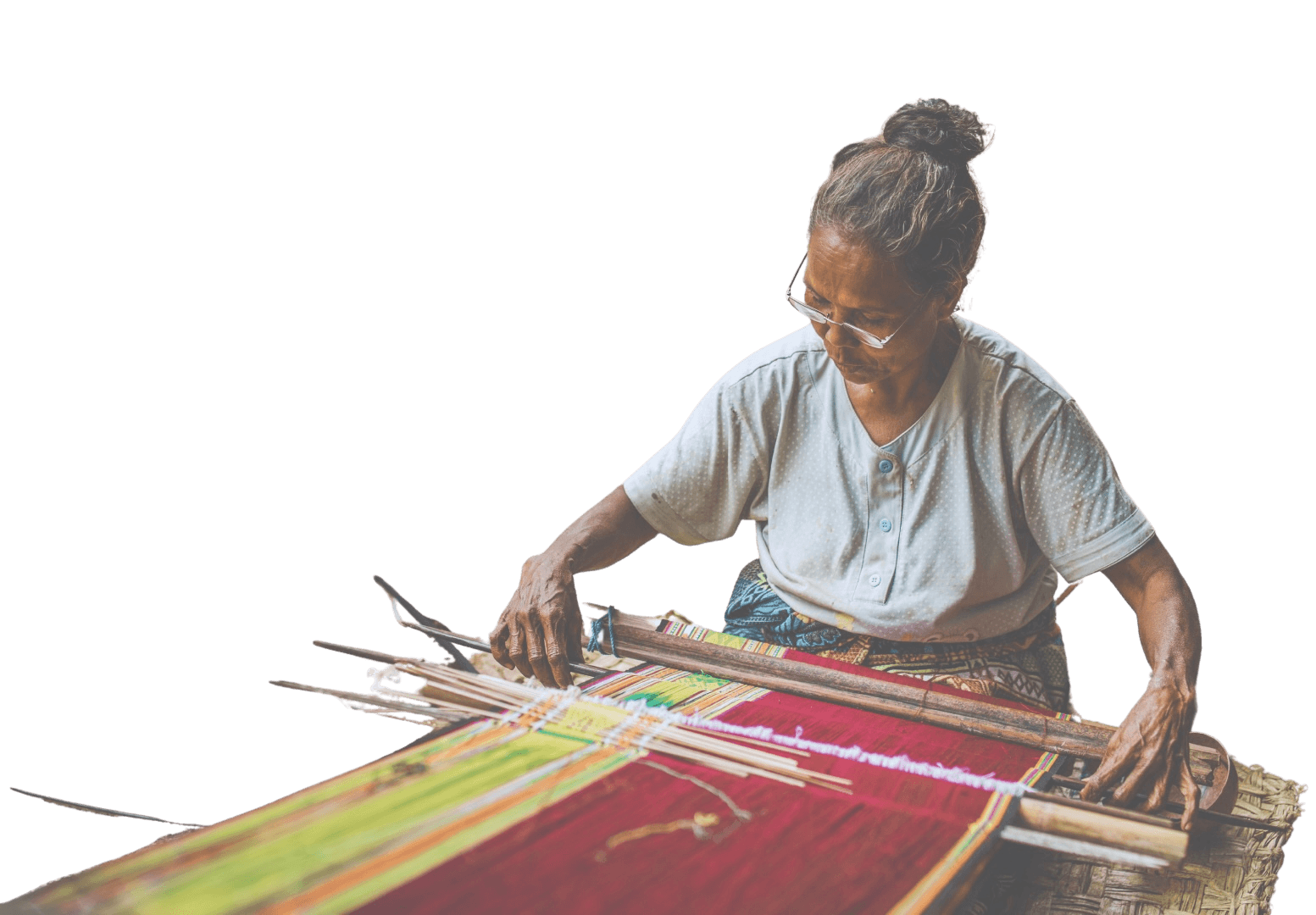 Woman weaving Kain Makna tenun